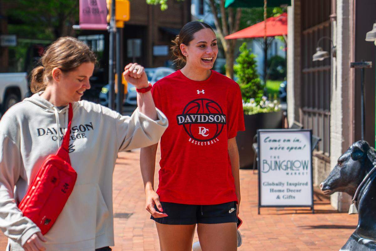 Davidson women’s basketball player Charlise Dunn smiles at a celebration in her honor in downtown Davidson on April 14. On April 13, Dunn became the first WNBA pick in school history.