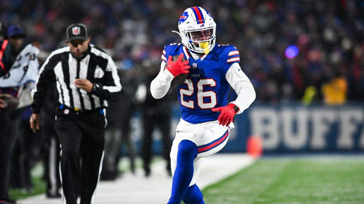 Jan 19, 2025; Orchard Park, New York, USA; Buffalo Bills running back Ty Johnson (26) runs the ball during the fourth quarter against the Baltimore Ravens in a 2025 AFC divisional round game at Highmark Stadium. Mandatory Credit: Mark Konezny-Imagn Images
