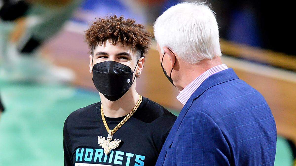 Charlotte Hornets guard LaMelo Ball, left and general manager Mitch Kupchak, right, talk after Ball was presented with a Rookie of the Month award at Spectrum Center in April. Kupchak shared Monday how the Hornets plan to attack the NBA draft this week.