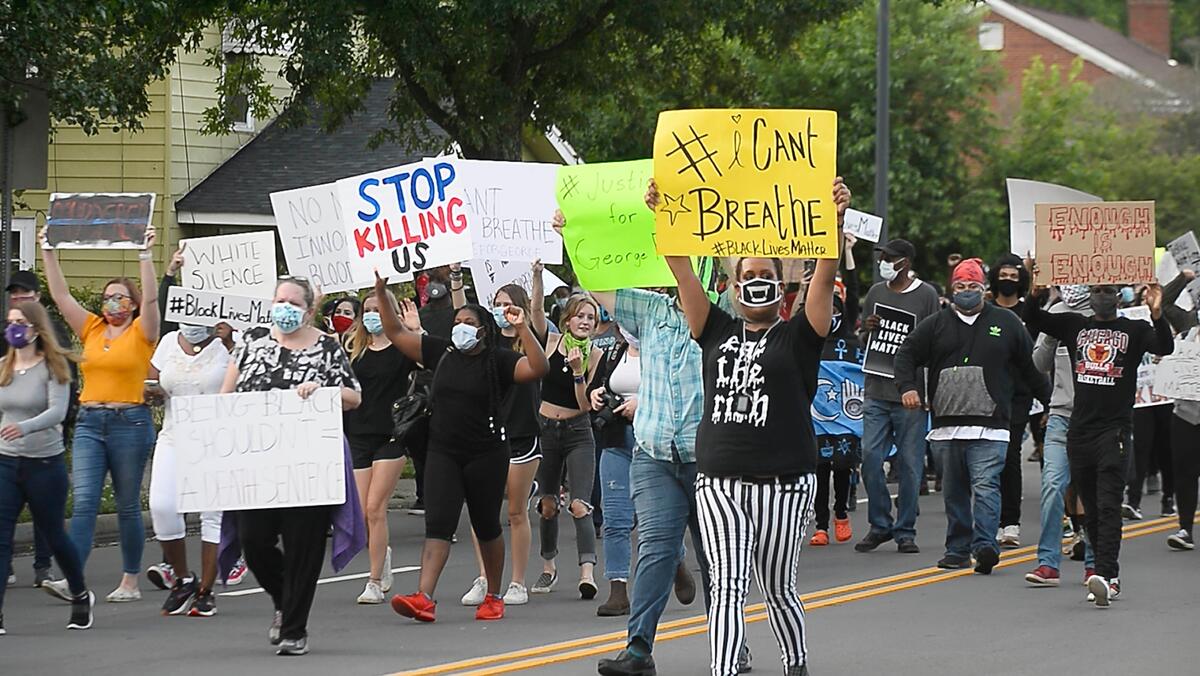 Protesters march in Charlotte, NC on Friday, May 29, 2020, during a rally over the death of George Floyd during his arrest in Minneapolis.