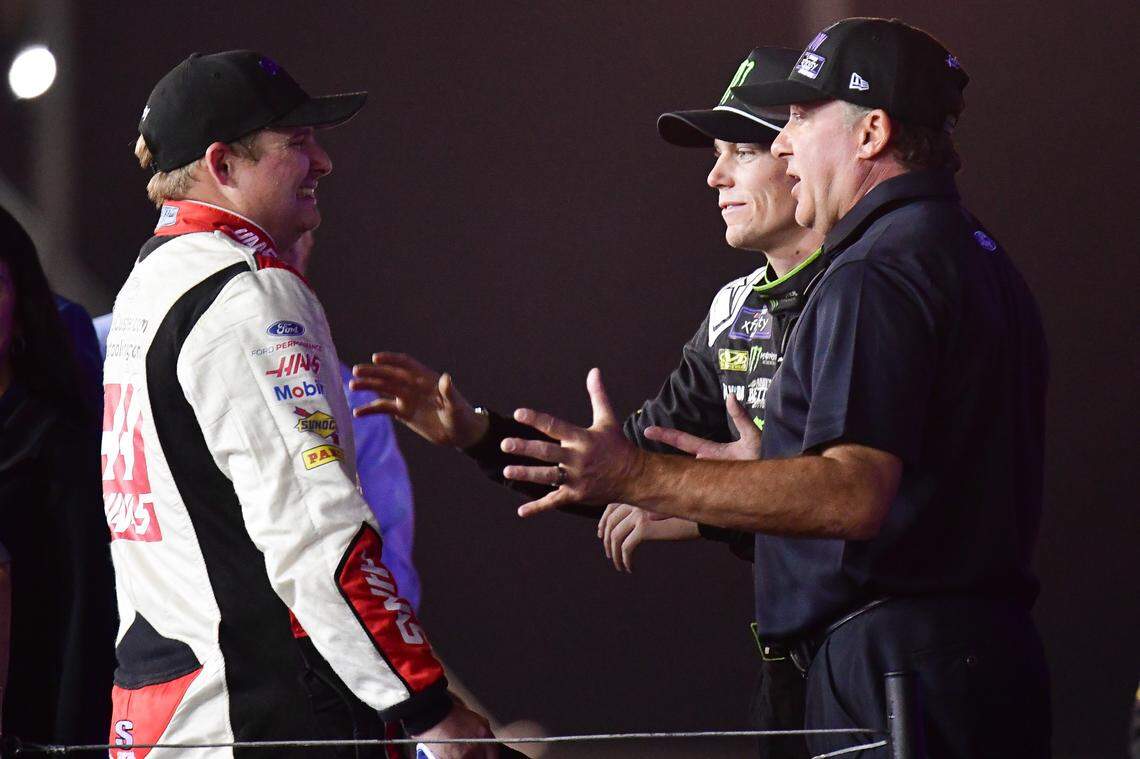 Tony Stewart and driver Riley Herbst (98) meet with driver Cole Custer (00) following his championship victory at the Xfinity race at Phoenix Raceway. / Gary A. Vasquez-USA TODAY Sports