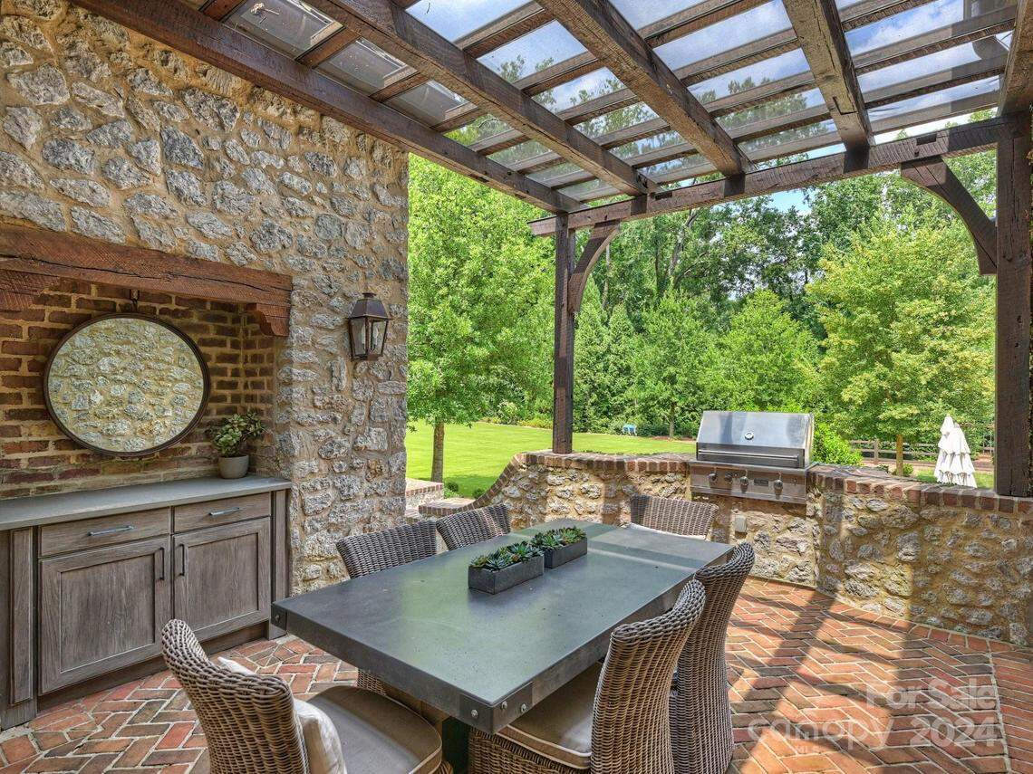 An outdoor dining area is shown at the south Charlotte mansion for sale for $12.5 million.
