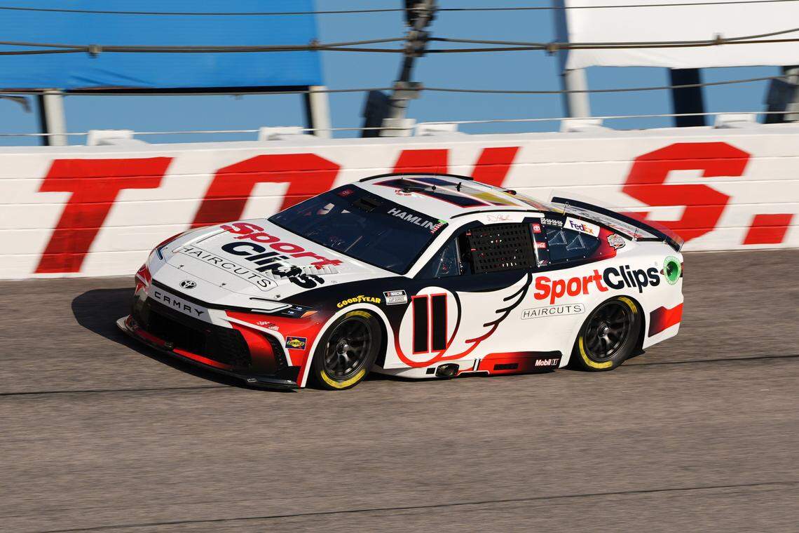 Sep 1, 2024; Darlington, South Carolina, USA; NASCAR Cup Series driver Denny Hamlin (11) races during the Cook Out Southern 500 at Darlington Raceway.