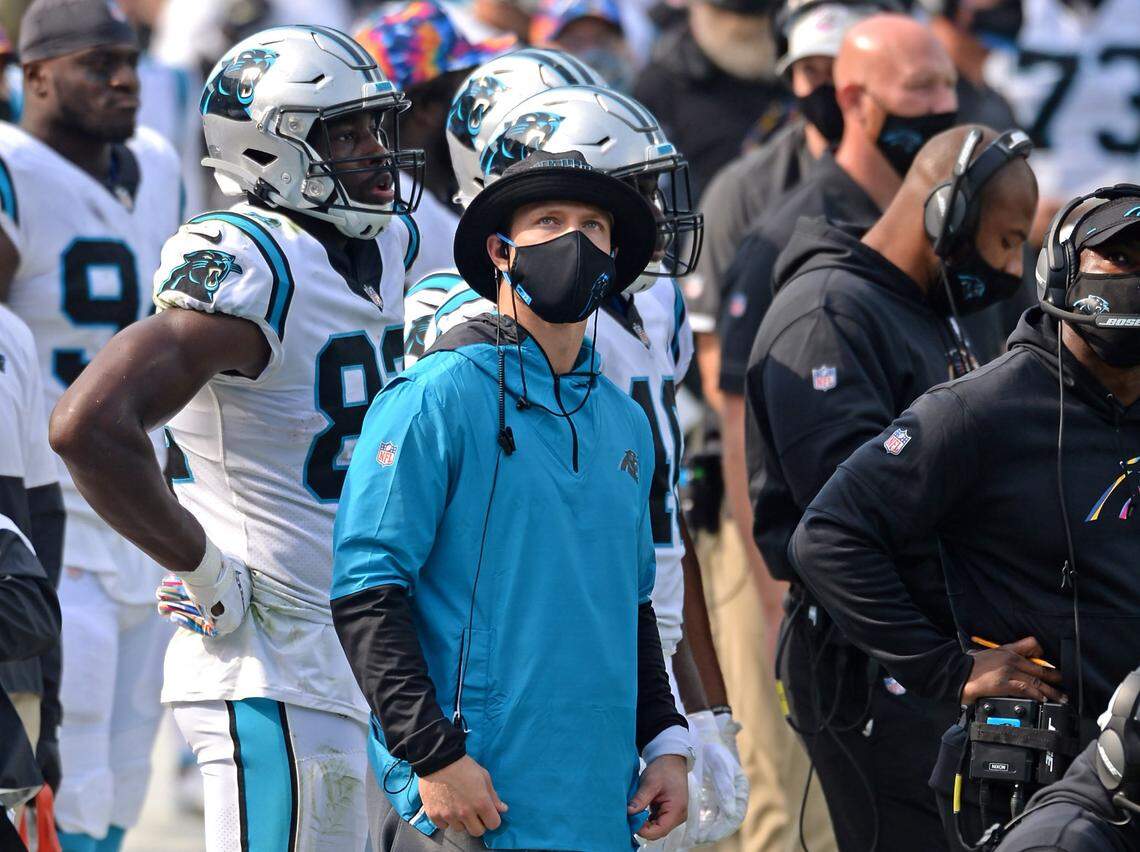 Injured Carolina Panthers running back Christian McCaffrey watches a replay on the Jumbotron during fourth quarter action against the Arizona Cardinals at Bank of America Stadium on Sunday, October 4, 2020. The Panthers defeated the Cardinals 31-21.