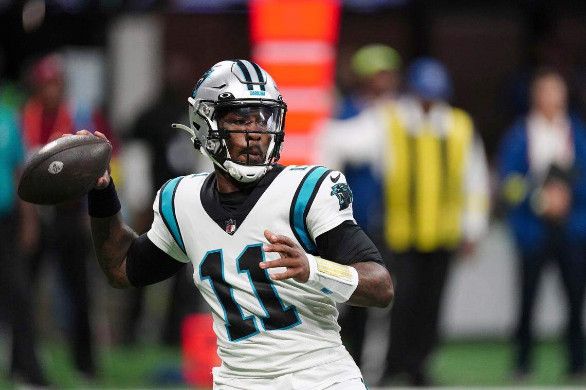 Carolina Panthers quarterback PJ Walker (11) throws during the first half of an NFL football game against the Atlanta Falcons Sunday, Oct. 30, 2022, in Atlanta. (AP Photo/John Bazemore)