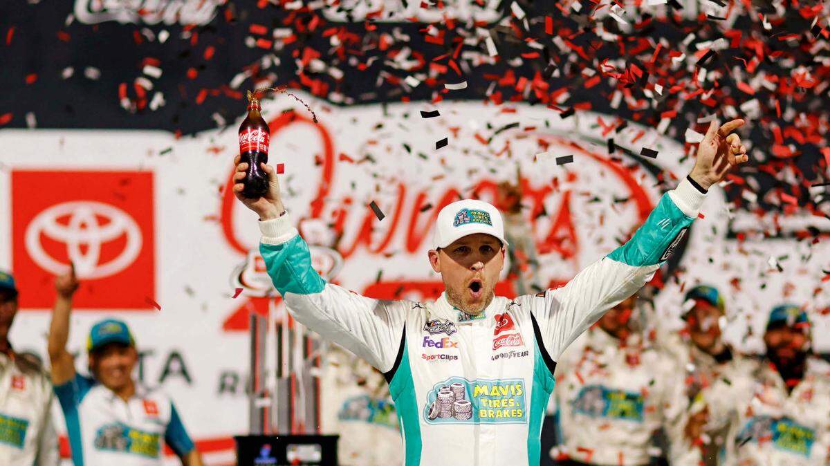 Mar 31, 2024; Richmond, Virginia, USA; NASCAR Cup Series driver Denny Hamlin (11) celebrates winning the Toyota Owners 400 at Richmond Raceway.