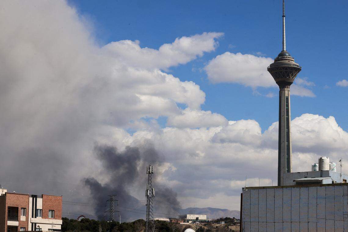 A plume of smoke rises following reported explosions in Tehran on March 1, 2026. Ayatollah Ali Khamenei, Iran's supreme leader since 1989, was killed in the opening salvo of a massive U.S. and Israeli attack, sparking a new wave of retaliatory missile strikes from Tehran on March 1. 