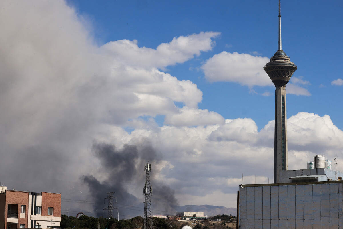 A plume of smoke rises following reported explosions in Tehran on March 1, 2026. Ayatollah Ali Khamenei, Iran's supreme leader since 1989, was killed in the opening salvo of a massive U.S. and Israeli attack, sparking a new wave of retaliatory missile strikes from Tehran on March 1. 