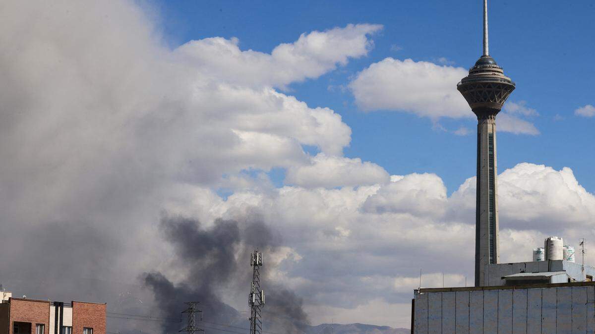 A plume of smoke rises following explosions in Tehran on March 1, 2026. Ayatollah Ali Khamenei, Iran's supreme leader since 1989 and sworn enemy of the West, was killed in the opening salvo of a massive US and Israeli attack.