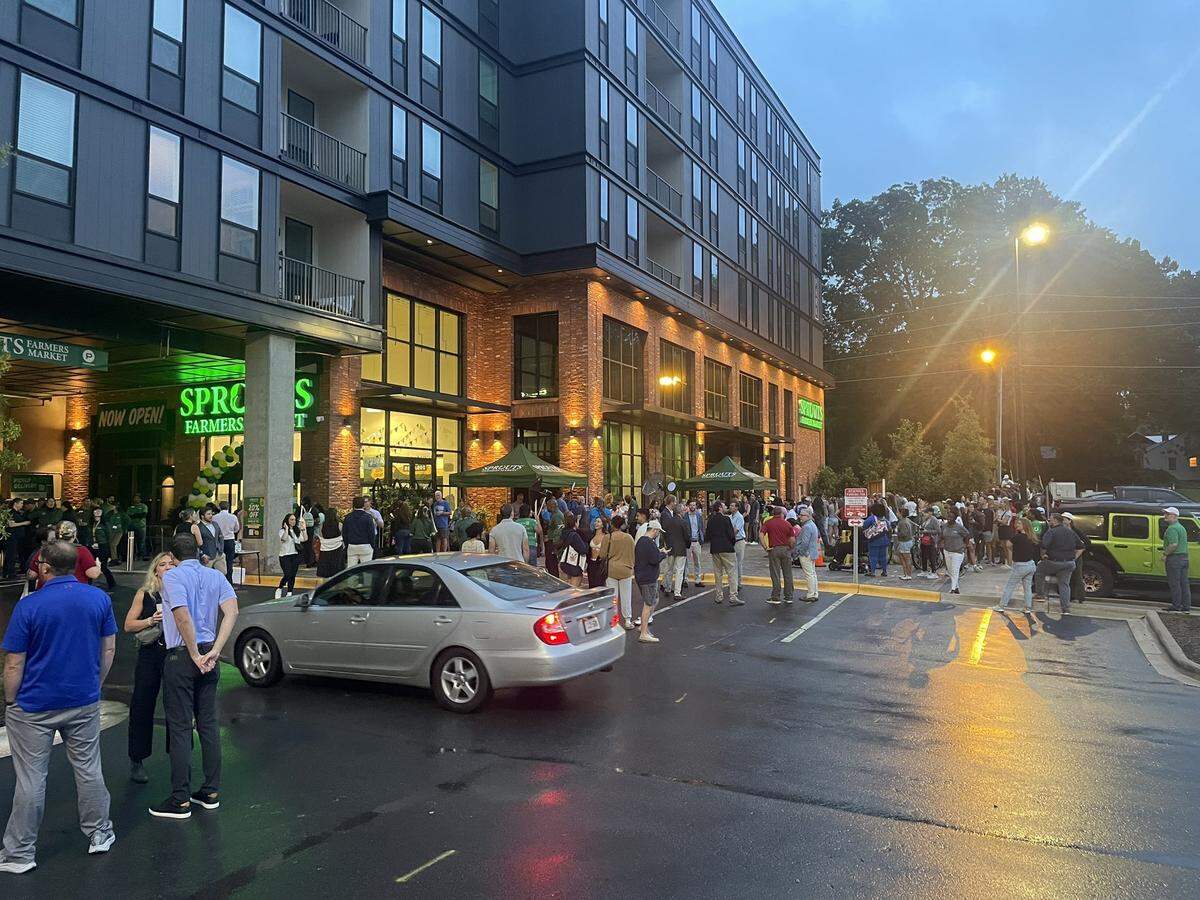 A line wrapped around the building before Sprouts Farmers Market opened at 7 a.m. at the mixed-use development by Avery Hall Southeast is on the corner of 36th and Tryon streets.