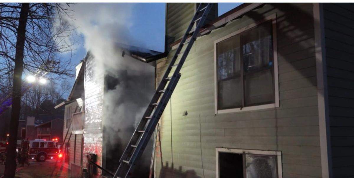 Firefighters attack a fire in a Charlotte apartment building on Wednesday.