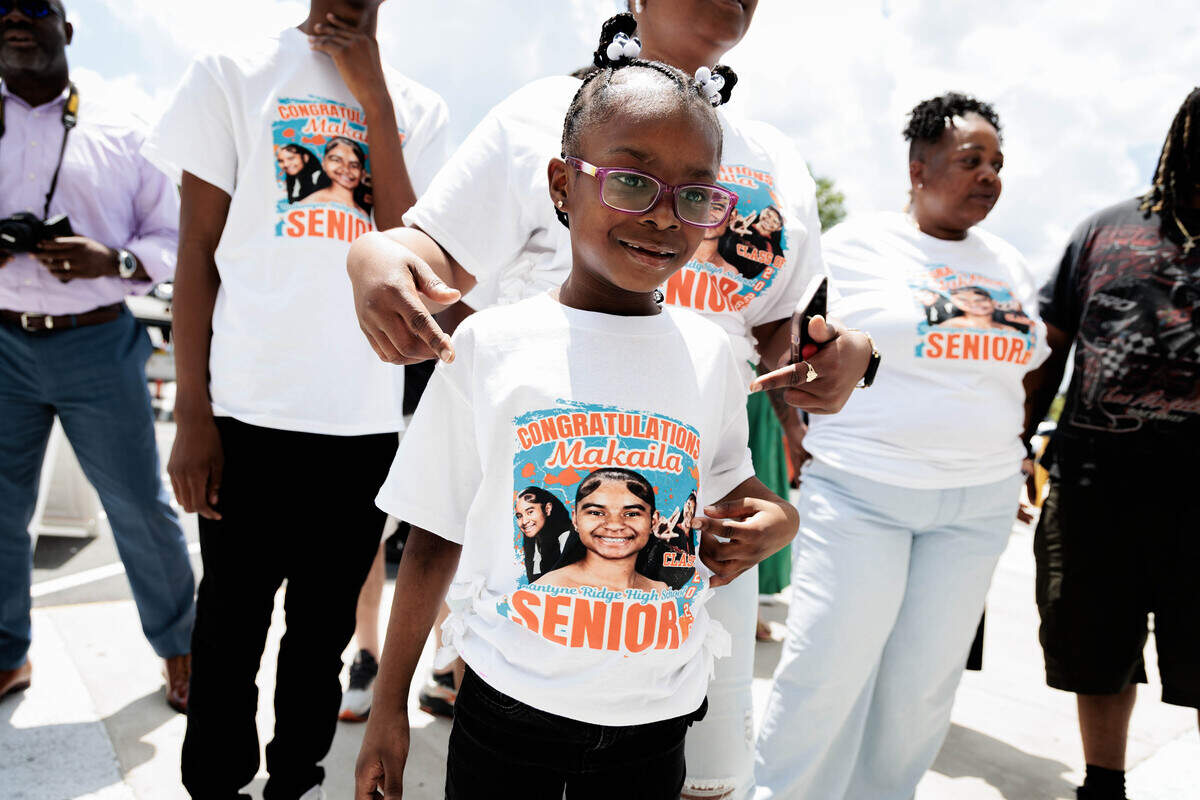 Anari Smith (7) wears a t-shirt in support of a Ballantyne Ride High School graduating senior on Saturday, June 13, 2026 outside the Bojangles Coliseum.