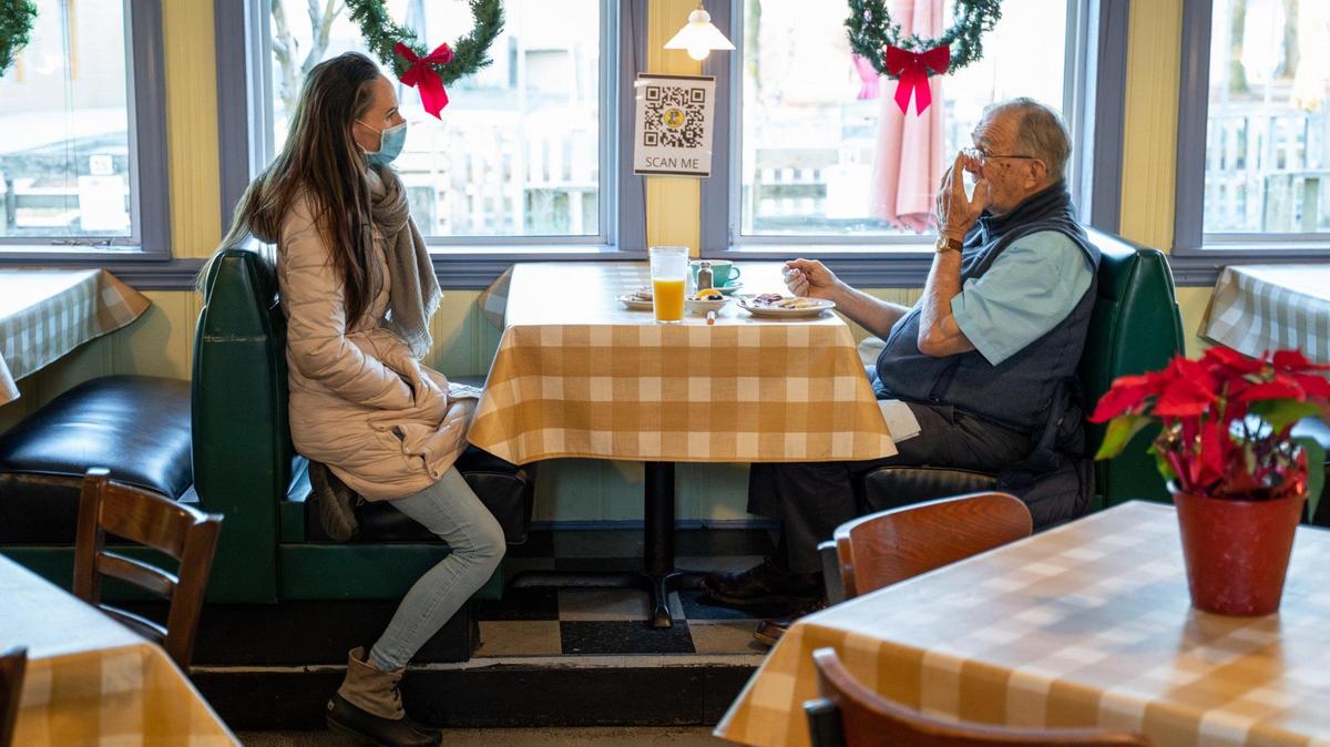 Former Sammy’s Deli employee Christina Black talks to former Sammy’s regular Bob Killough while he eats breakfast at Dish, where they’ve both landed.
