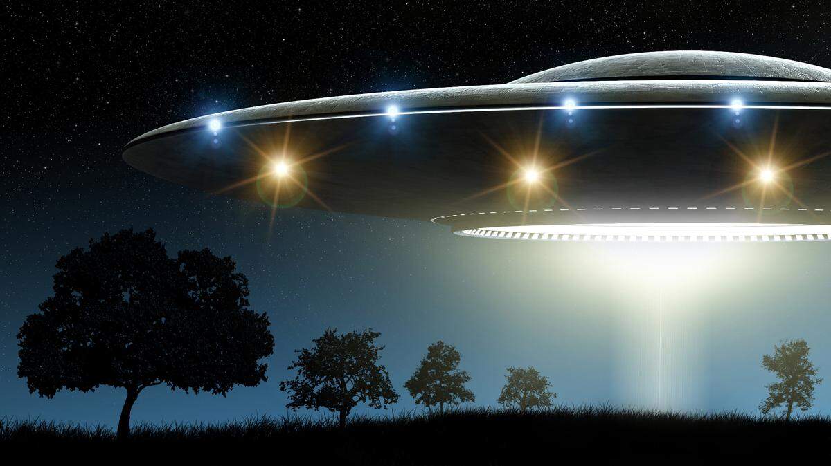 3d rendering of flying saucer ufo on night background