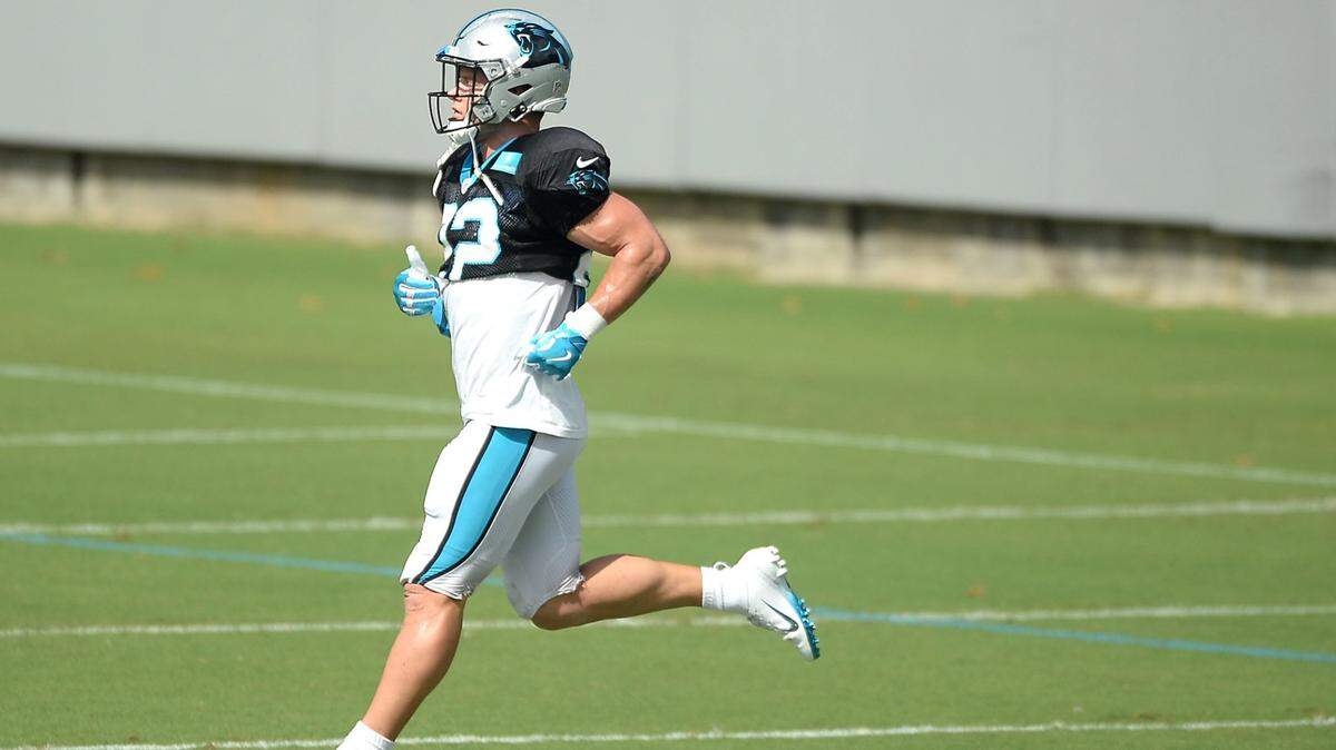 Carolina Panthers running back Christian McCaffrey runs across a field during practice on Wednesday, October 6, 2021. McCaffrey is questionable to play Sunday but said Thursday he thought that he would be able to.