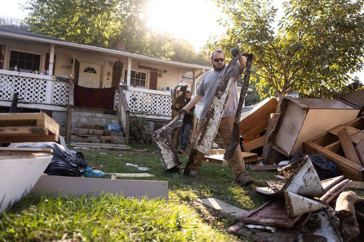 Bob Stansell cleans out his Canton home in October 2024, after it was flooded by Helene.