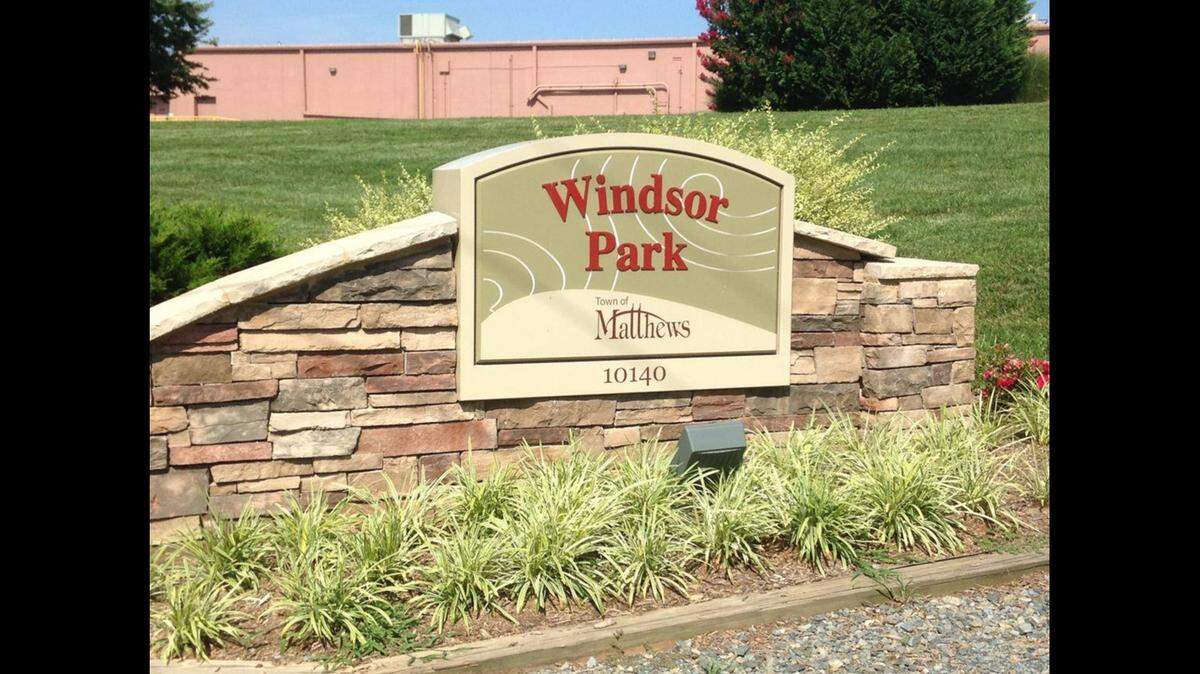 Two men and a woman were hospitalized after gunshots erupted at child custody exchange in Windsor Park, Matthews Police Department says.