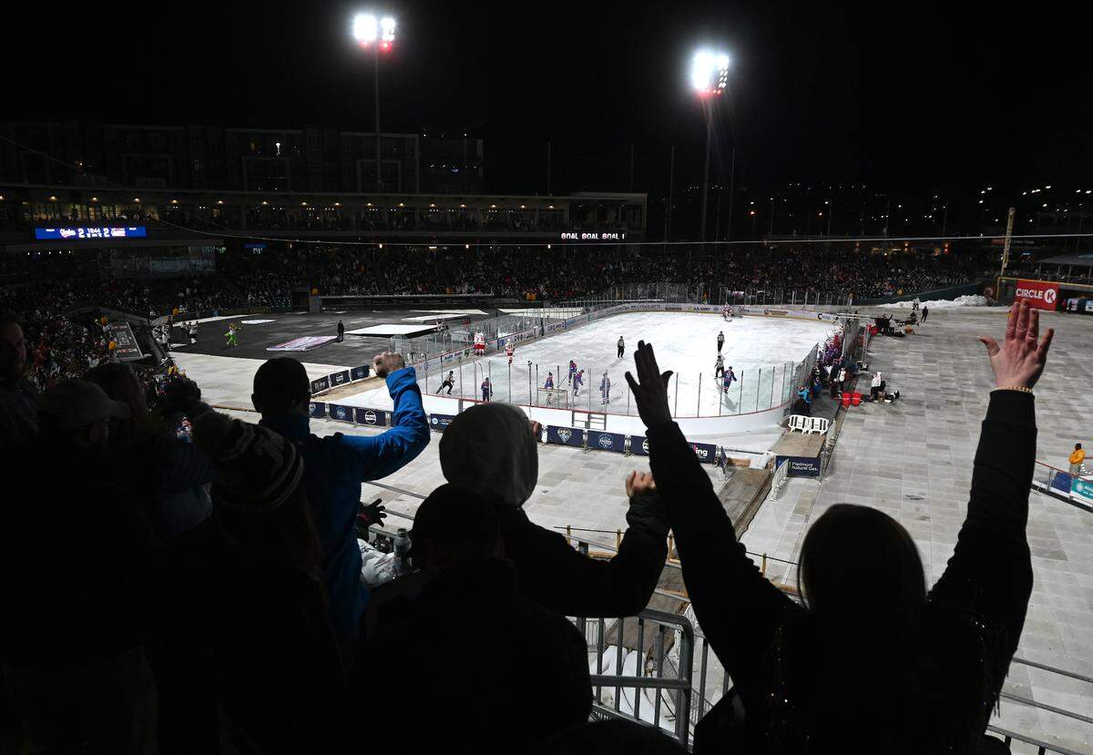 Charlotte Checkers celebrate the team’s third goal against the Rochester Americans in the 2024 Queen City Outdoor Classic at Truist Field in uptown Charlotte, NC on Saturday, January 13, 2024.