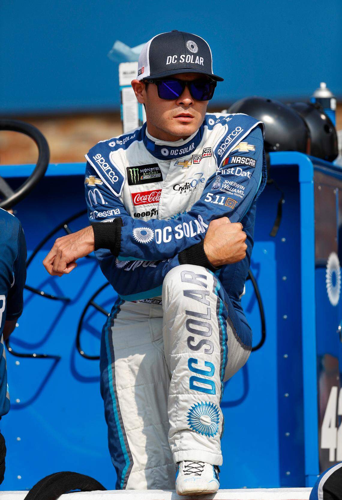 Kyle Larson watches before qualifications for a NASCAR Cup Series auto race at Michigan International Speedway in Brooklyn, Mich., Friday, Aug. 10, 2018. (AP Photo/Paul Sancya)