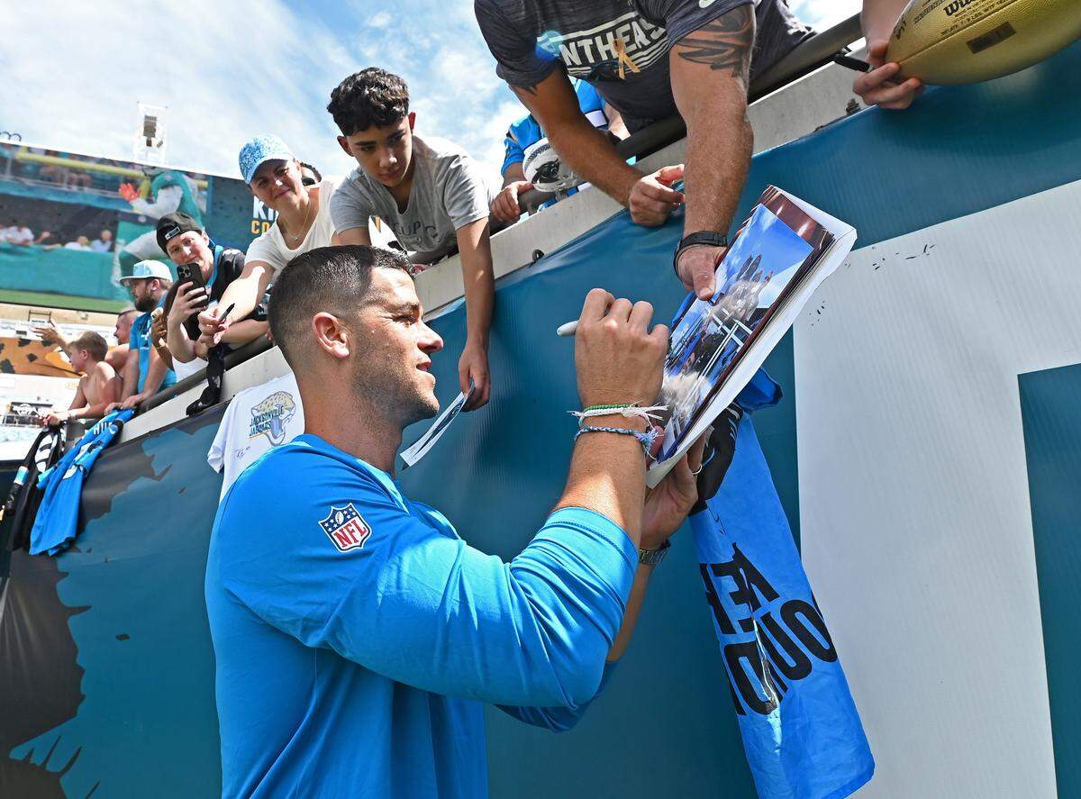 Carolina Panthers head coach Dave Canales stops to sign autographs for fans prior to their game against the Jacksonville Jaguars on Sunday, September 7, 2025 at Everbank Stadium in Jacksonville, Florida.