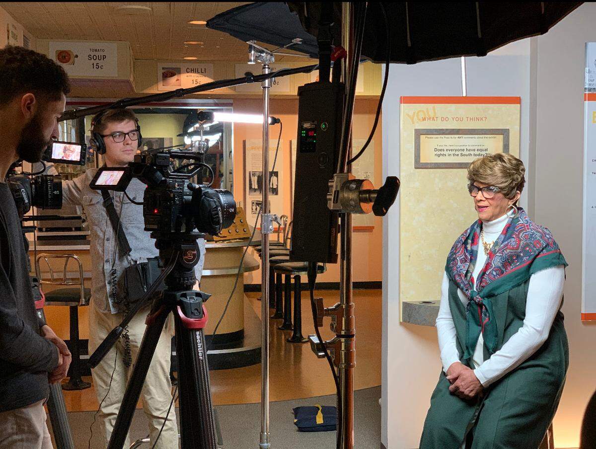 Dorothy Counts-Scoggins is interviewed at the Levine Museum for the Interactive CLT app. The Levine is one of four Charlotte museums using the new augmented reality app. Levine visitors can hear Counts-Scoggins, the first Black student to integrate Harding High School, talk about what it felt like that day in 1957.