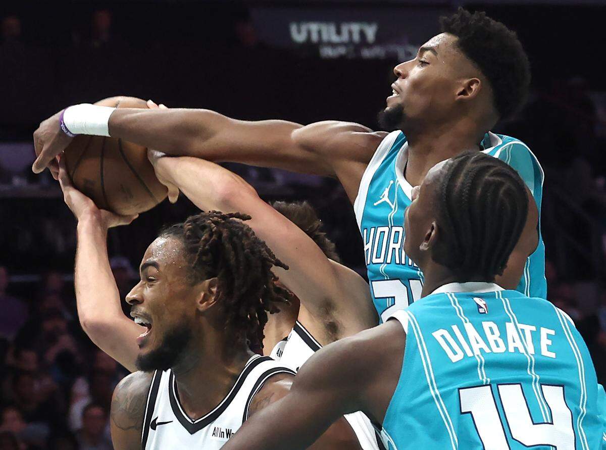 Charlotte Hornets guard Brandon Miller blocks the shot of a Brooklyn Nets opponent on a drive to the basket on Wednesday, October 22, 2025 at Spectrum Center in Charlotte, NC. The Hornets defeated the Brooklyn Nets 136-117.