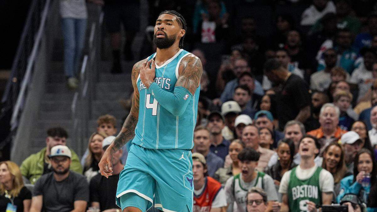 Charlotte Hornets center Nick Richards (4) holds his shoulder after a hard scrum under the basket against the Boston Celtics during the second quarter at the Spectrum Center.