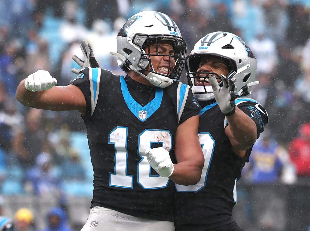 Carolina Panthers wide receiver Jalen Coker, left and running back Chuba Hubbard, right, celebrate Coker’s touchdown reception during action at Bank of America Stadium in Charlotte, NC on Sunday, Nov. 30, 2025. The Panthers defeated the Rams 31-28.