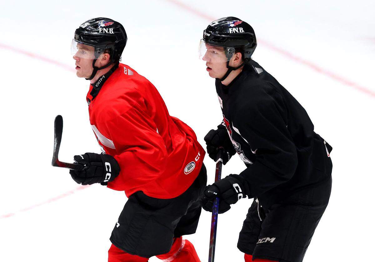Charlotte Checkers Wilmer Skoog, left, fronts a teammate near the goal during practice at BoJangles Coliseum in Charlotte, NC on Thursday, October 9, 2025.
