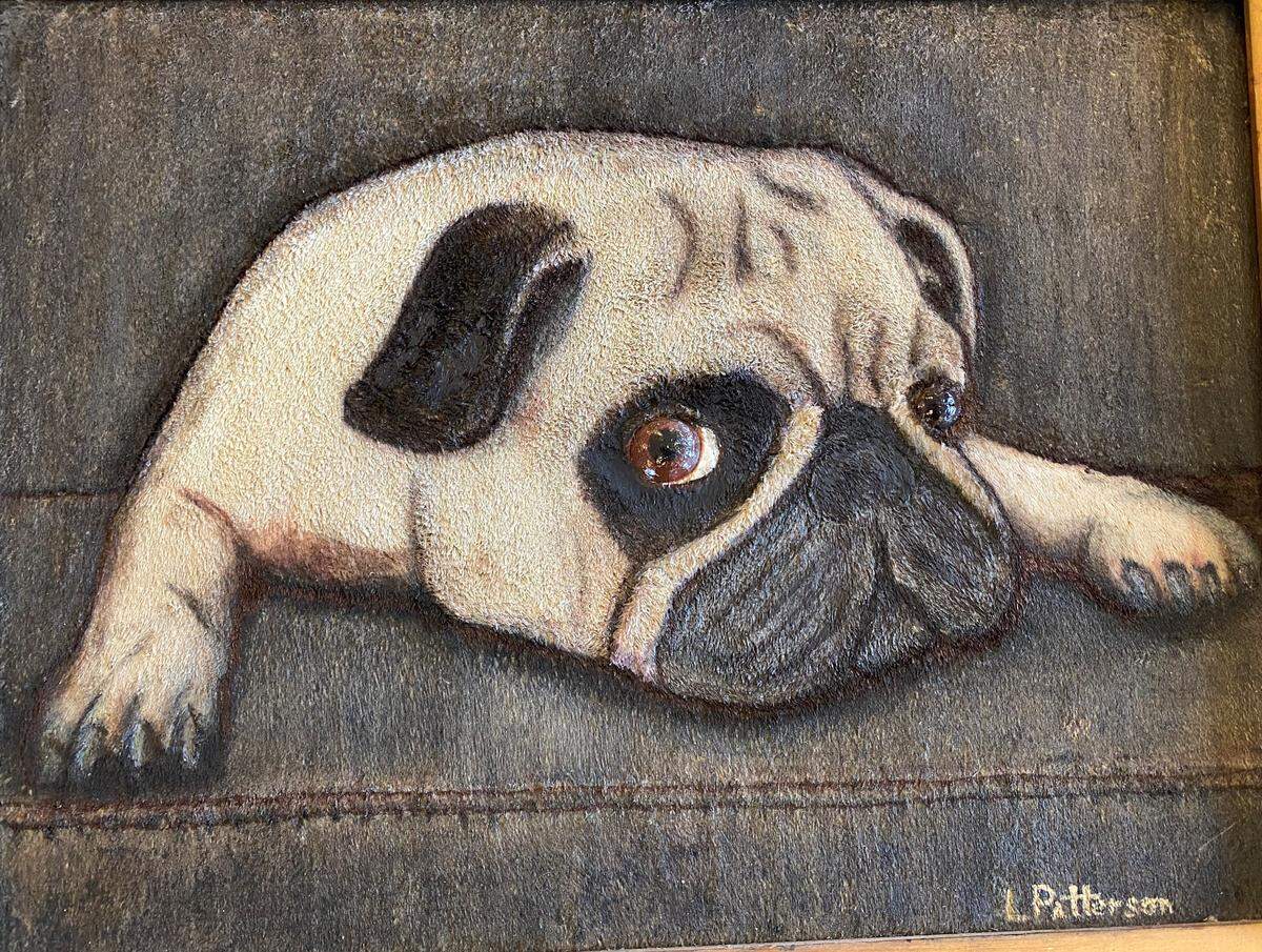 This is a close-up of a painting by Lewis Patterson called “Mr. Pug.” Patterson, a Vietnam War vet, likes to paint animals and nature.
