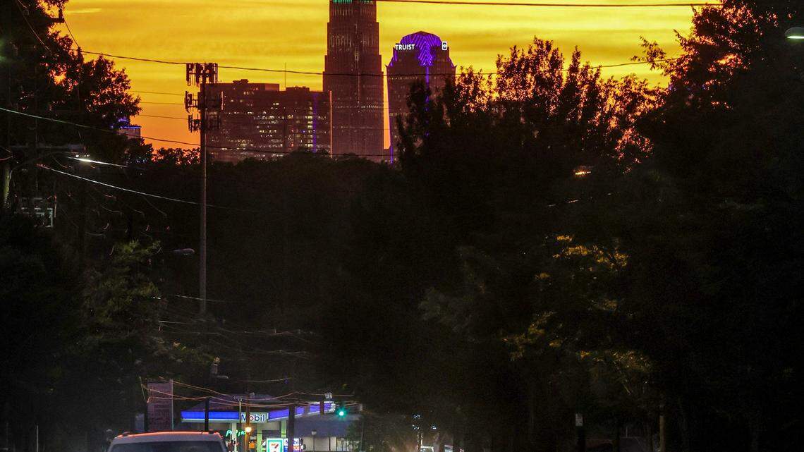 The sun sets over the city as seen from Central Avenue on Friday, June 16, 2022 in Charlotte, NC.