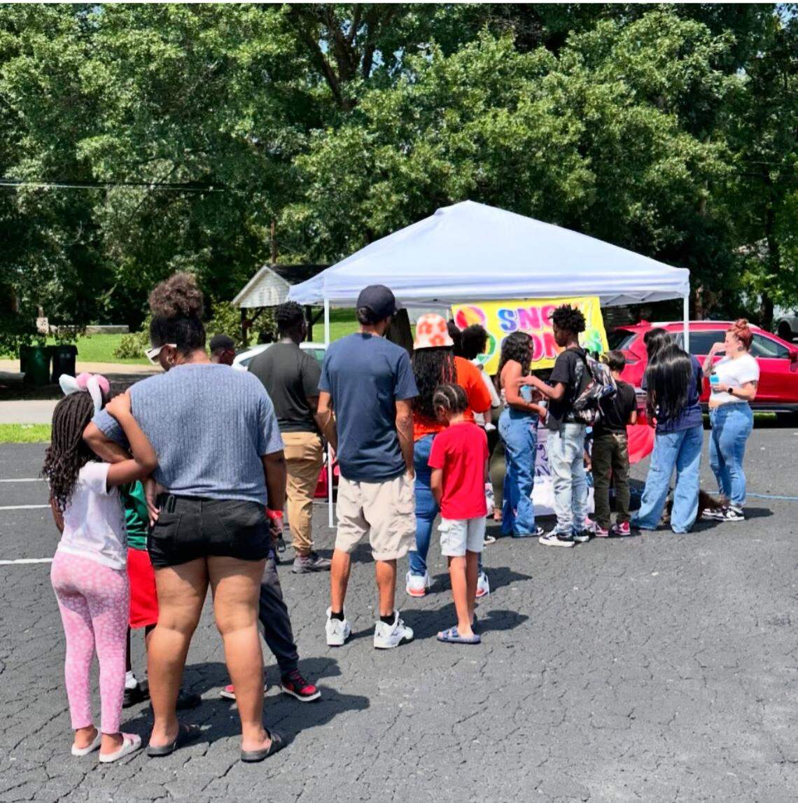 Customers wait in the line for snow cones during an event for Nxt Big Thing Charlotte. The organization is preparing for a large expo event on the campus of Johnson C. Smith University.