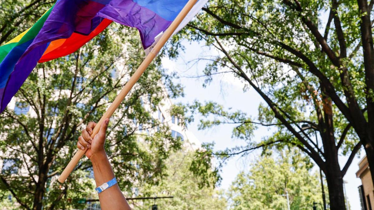Juwan Linkston waves a rainbow flag as he marches in the Charlotte Pride Parade in Charlotte, N.C., Sunday, Aug. 20, 2023. (Photo: Nell Redmond)