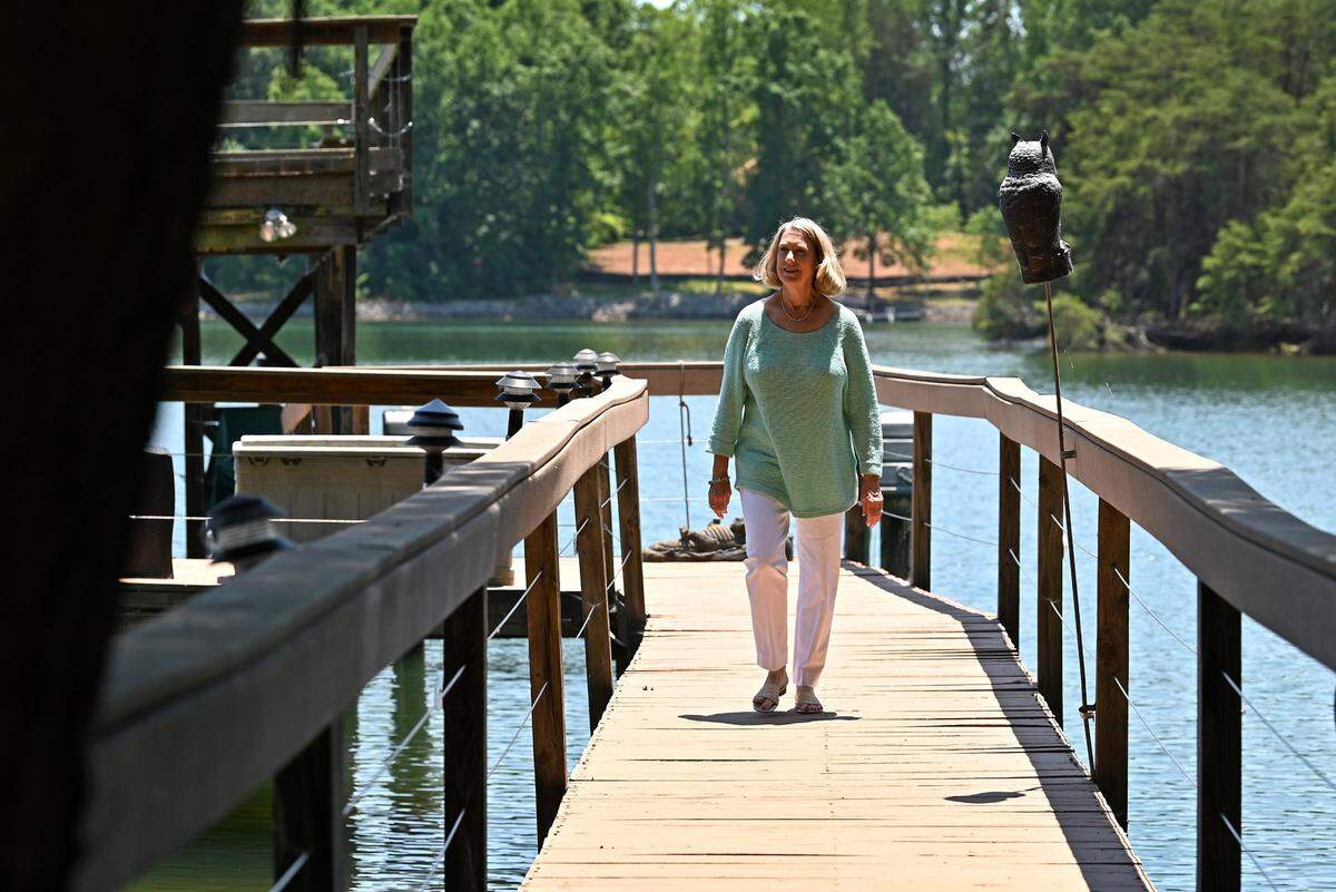 Judy Rose walks on the deck near her home on Monday, June 6, 2022. Rose was the athletic director for the Charlotte 49ers for 28 years, until retiring in 2018.