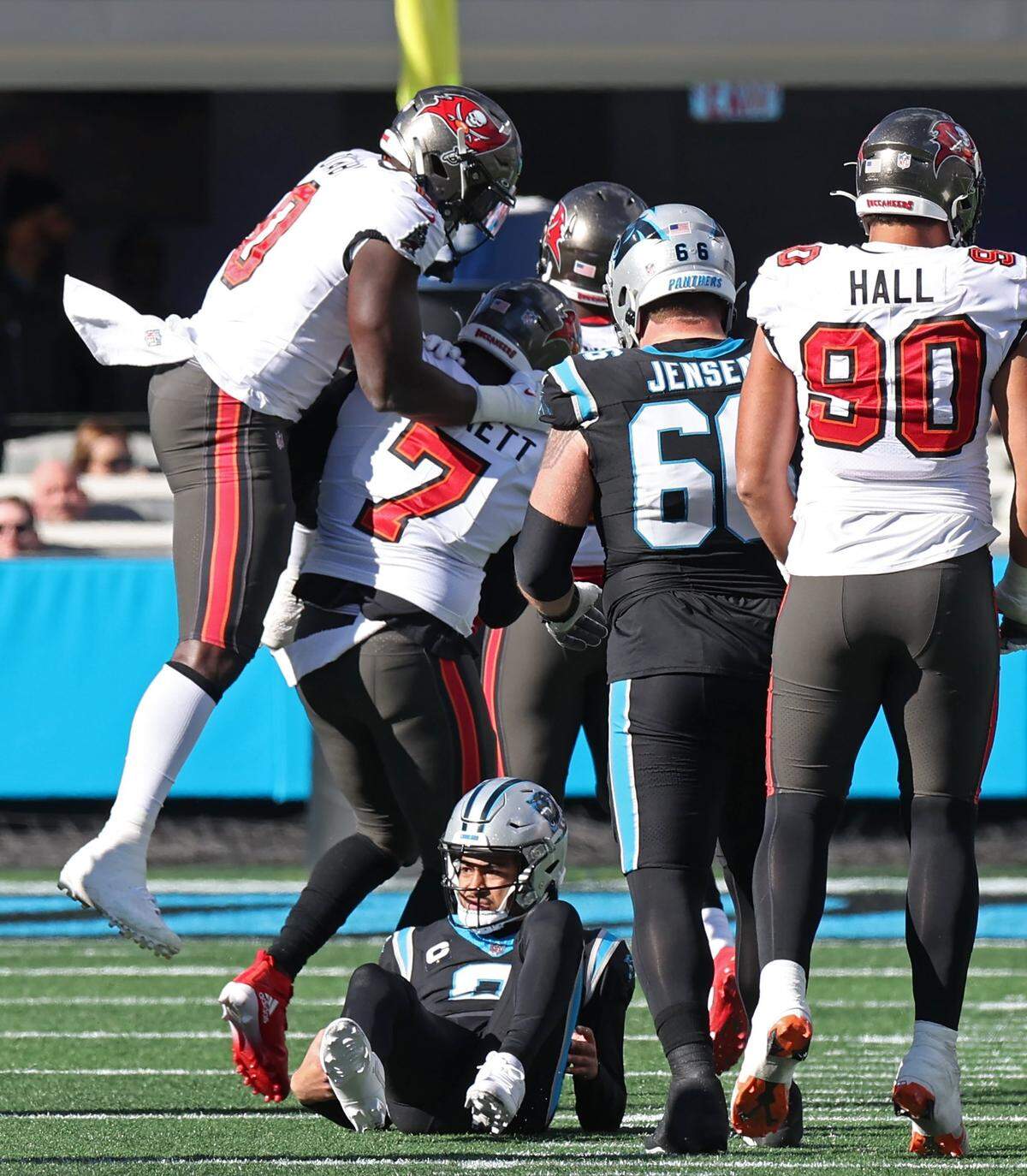 The Tampa Bay Buccaneers defense celebrate after knocking Carolina Panthers quarterback Bryce Young to the turf during action at Bank of America Stadium in Charlotte, NC on Sunday, January 7, 2024.