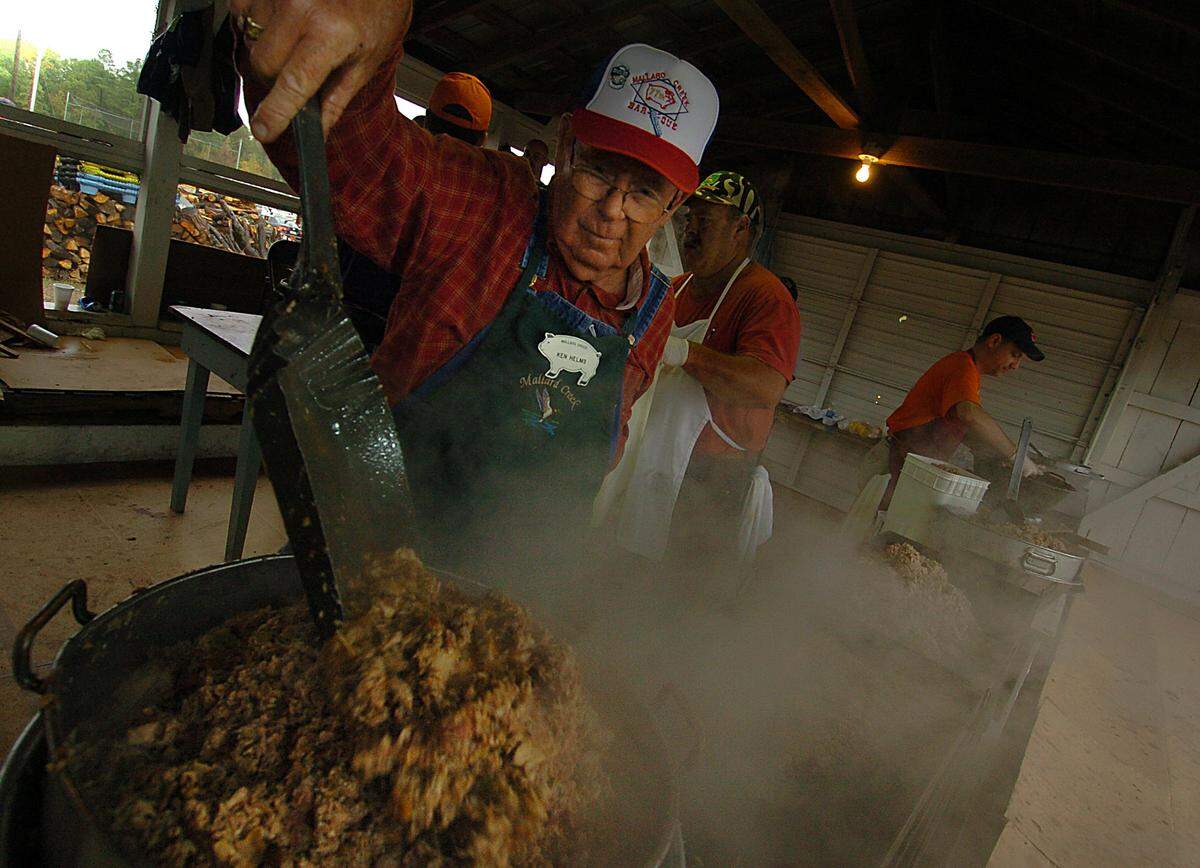 David Helms, 71, fills a pot with steaming hot barbecue during the 78th annual Mallard Creek BBQ Thursday, Oct. 25, 2007. Helms had been working the event for 51 years. 