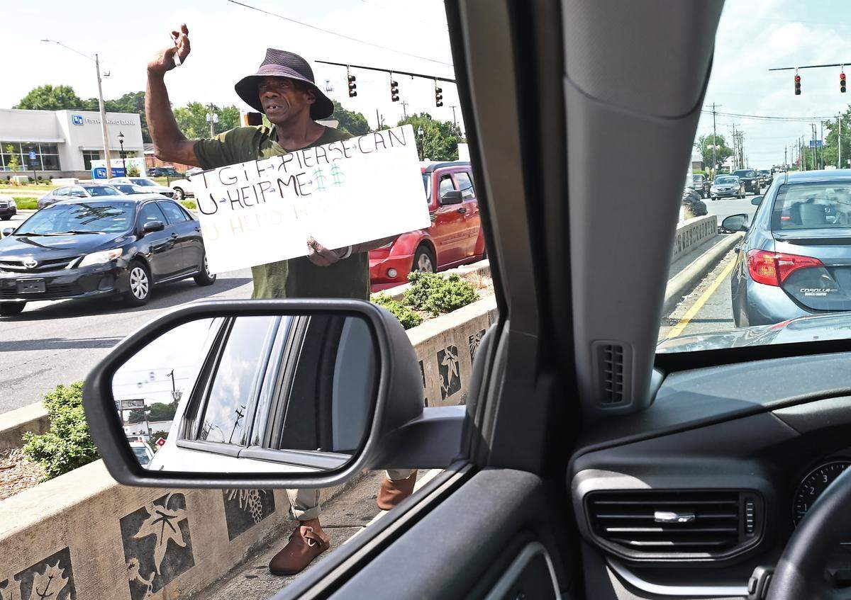 Photos: Life with Lefty and Kenny at the corner of Woodlawn Road and South Boulevard