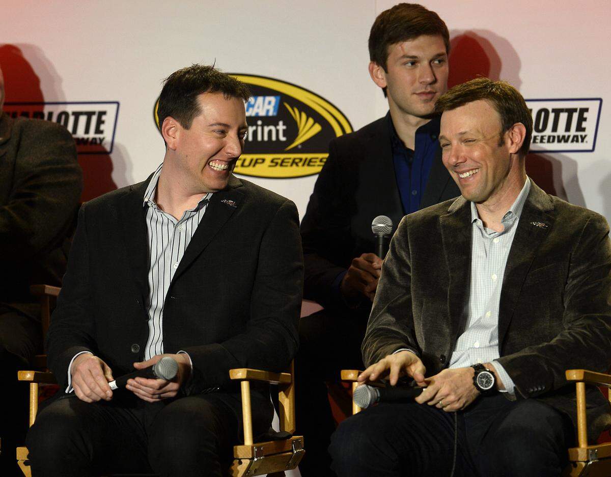 (L-R) NASCAR Sprint Cup Series drivers Kyle Busch and Matt Kenseth joke with one another during the Joe Gibbs Racing interview session with media on Monday, January 26, 2015 at the Charlotte Motor Speedway Media Tour in Charlotte, NC. The tour is being held at the Charlotte Convention Center. xfinity driver Daniel Suarez looks on in the background. 