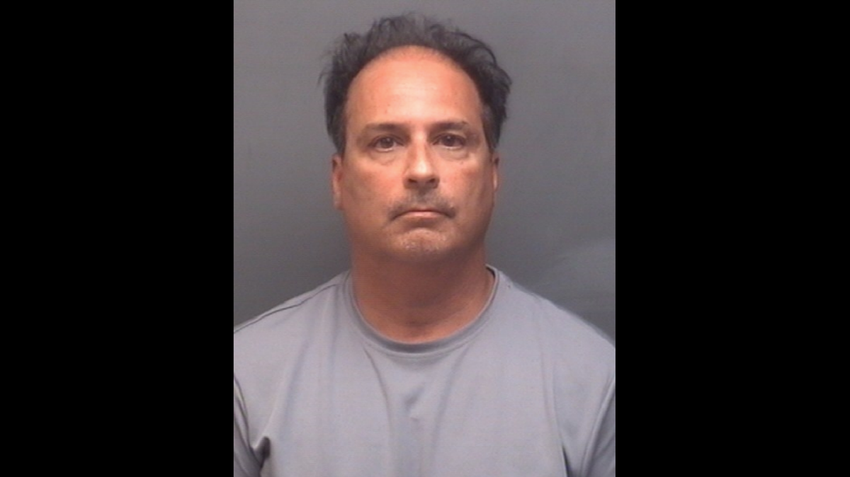 Ronald Cohen, 56, faces assault charges after a woman filmed him spitting on her windshield multiple times and calling her a vulgar name in an apparent road rage incident, police in North Carolina said. 