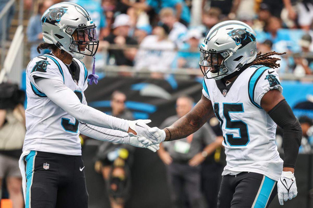 Panthers wide receiver Robbie Anderson, left, congratulates teammate Laviska Shenault, Jr. after he scored a touchdown during the game against the Saints at Bank of America Stadium on Sunday, September 25, 2022 in Charlotte, NC. The Panthers pulled out their first win of the season by defeating the Saints 22-14.
