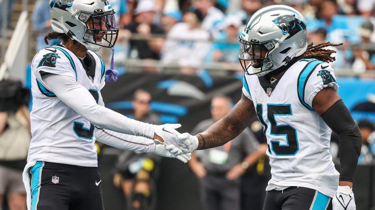 Panthers wide receiver Robbie Anderson, left, congratulates teammate Laviska Shenault, Jr. after he scored a touchdown during the game against the Saints at Bank of America Stadium on Sunday, September 25, 2022 in Charlotte, NC. The Panthers pulled out their first win of the season by defeating the Saints 22-14.