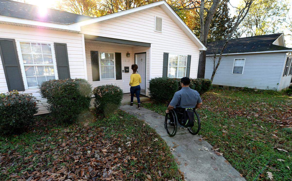 Chablis Dandridge and his wife, K. Devonne Dandridge go back into their home on Monday, November 23, 2020. Chablis was convicted of drug and weapons charges and spent 13 years in federal prison. Since being released in 2017, he has worked with ex-offenders on policies to aid re-entry and rehabilitation. Chablis is a member of the Re-entry Housing Alliance, which is promoting a “Fair Chance” housing ordinance which would add protections to the city’s fair housing ordinance. It would prevent landlords from automatically screening out applicants with criminal records until they have considered other rental eligibility and allow prospective tenants to show evidence of rehabilitation to strengthen their case.