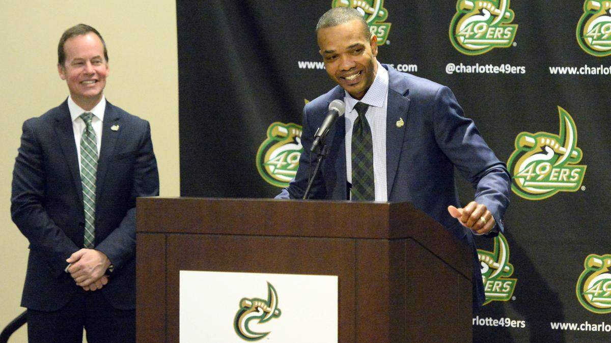 New Charlotte 49ers men’s basketball coach Ron Sanchez addresses media and university supporters during his introductory news conference on Tuesday. New athletics director Mike Hill looks on.