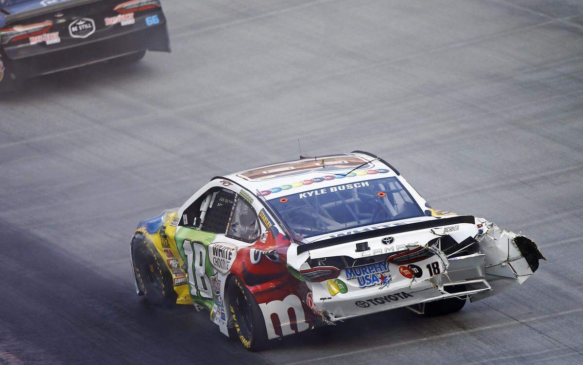 Kyle Busch make his way around the track after being involved in a crash during the NASCAR Cup Series auto race Saturday, Aug. 18, 2018, in Bristol, Tenn. (AP Photo/Wade Payne)