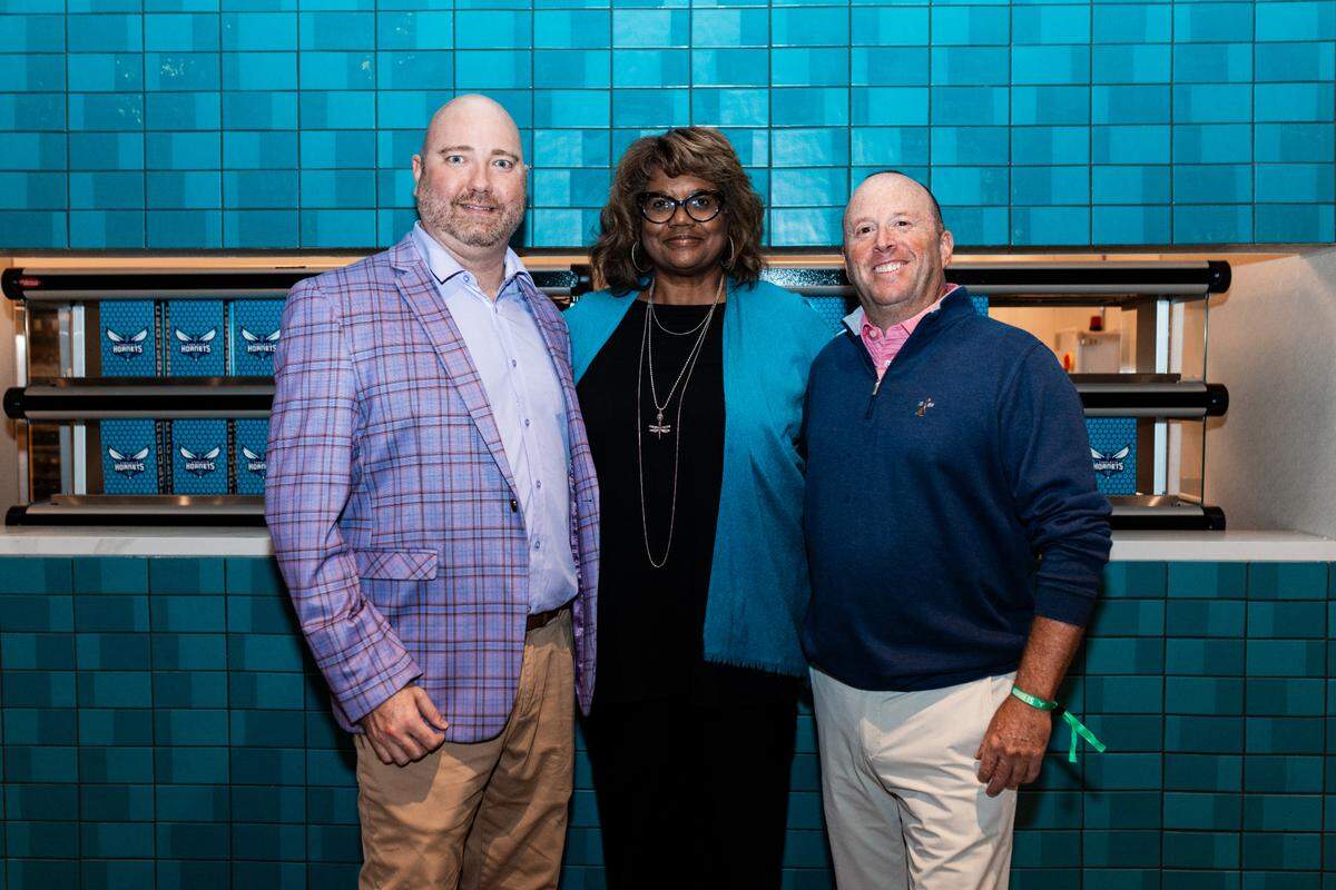 Carter Witt of Levy, Donna Julian of the Hornets and Jon Dressler of Rare Roots Hospitality are among the partners working to bring Spectrum Center guests more local, elevated food options.