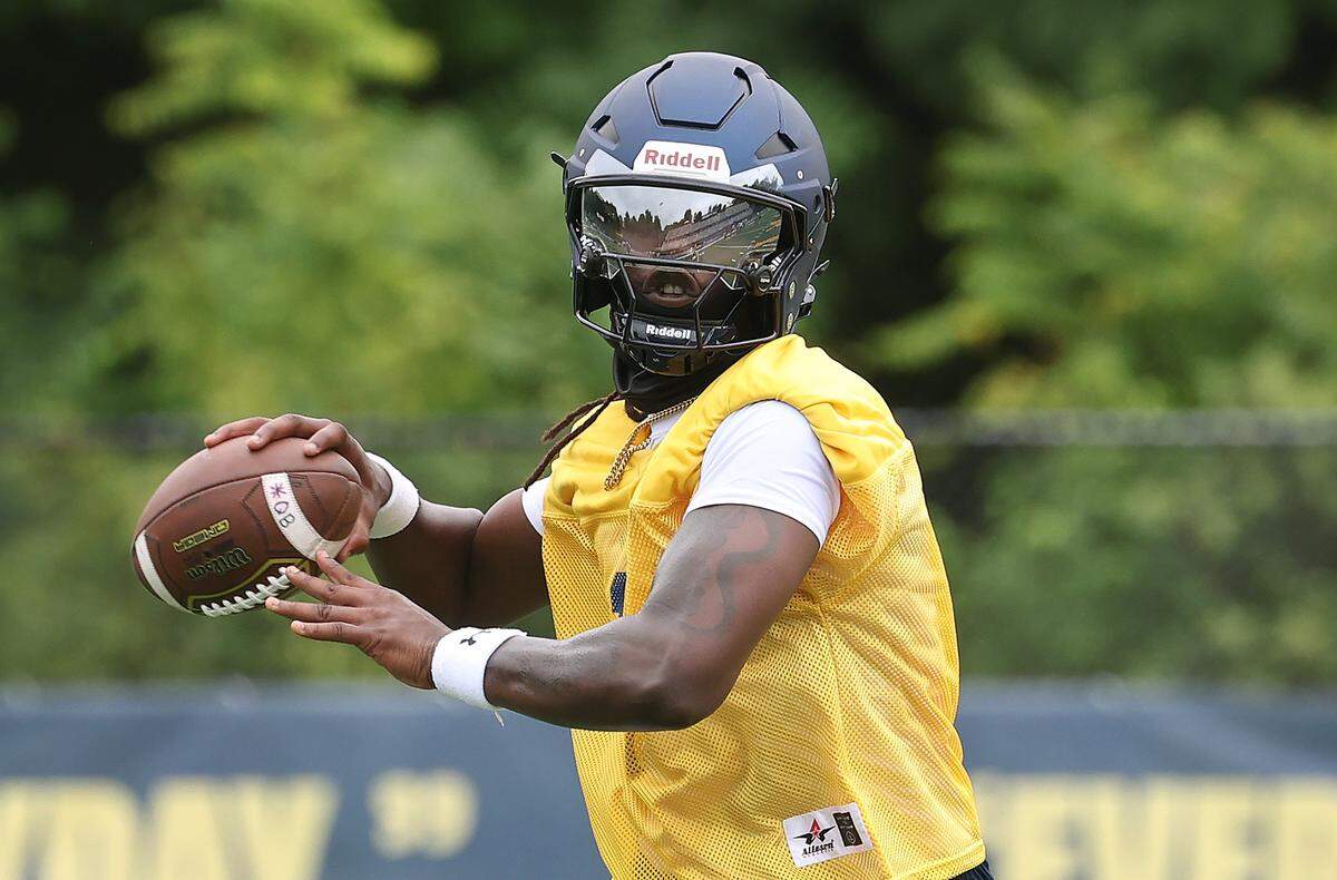 Johnson C. Smith University quarterback Kelvin Durham passes to a receiver during practice on Wednesday, August 6, 2025.