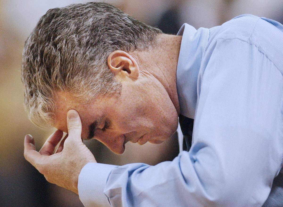 UNC head coach Matt Doherty puts his head down as his team falls behind the Georgia Tech Yellow Jackets in 2003.