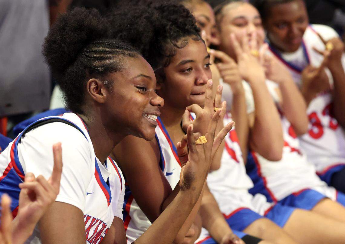 Members of the North Meck girls basketball team pose with toy rings following their 65-38 win over Southern Durham in the NCHSAA 7A girls championship game on Saturday, March 14, 2026 at Lawrence Joel Veterans Memorial Coliseum in Winston-Salem, N.C.