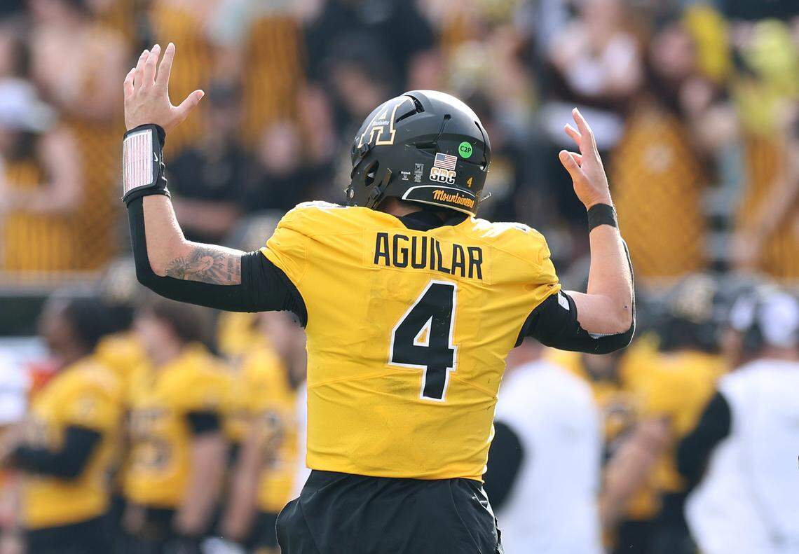 Appalachian State quarterback Joey Aguilar jogs off the field signaling his two-point conversion run during second-half action against Georgia State at Kidd Brewer Stadium in Boone, NC on Saturday, October 26, 2024. The game was Appalachian State’s first home game since Hurricane Helene struck the area.
