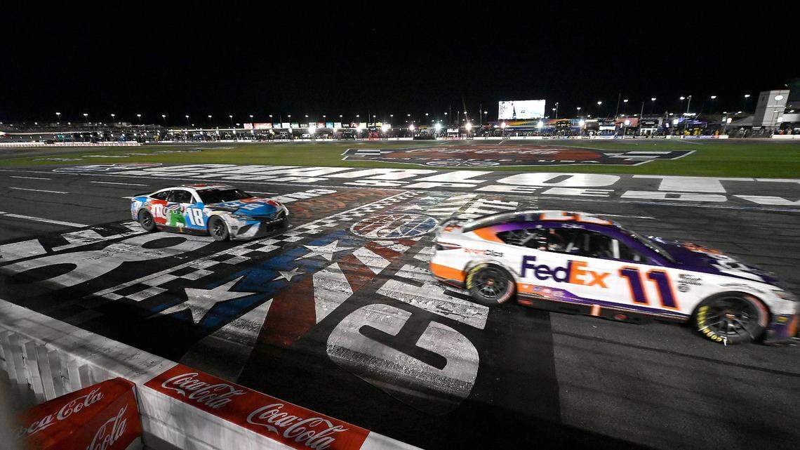 NASCAR driver Denny Hamlin crosses the finish line to win the Coca-Cola 600 at Charlotte Motor Speedway on Sunday, May 29, 2022. Hamlin held off Kyle Busch for the victory.